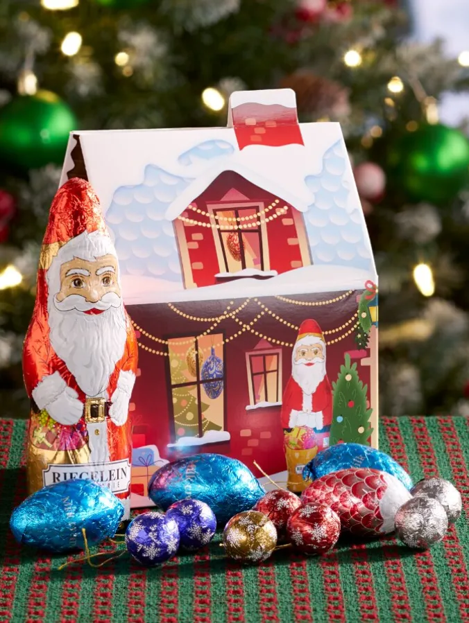 German Christmas House With Chocolate Santa and Ornaments